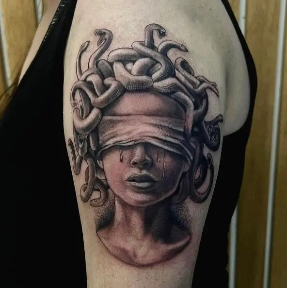 Blindfolded Medusa Arm Tattoo