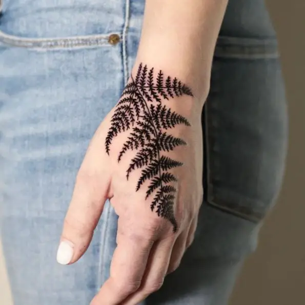 Bold Black Fern Leaves Hand Tattoo