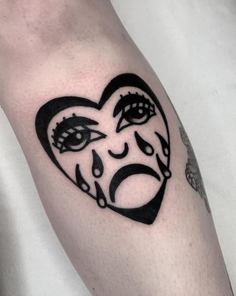 Bold Black Ink Crying Heart Leg Tattoo
