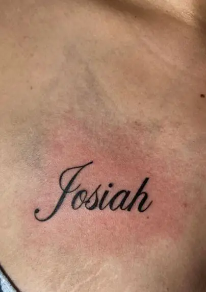 Bold Inked Name Chest Tattoo