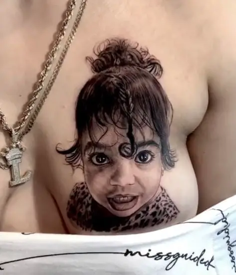 Child Face Portrait Breast Tattoo