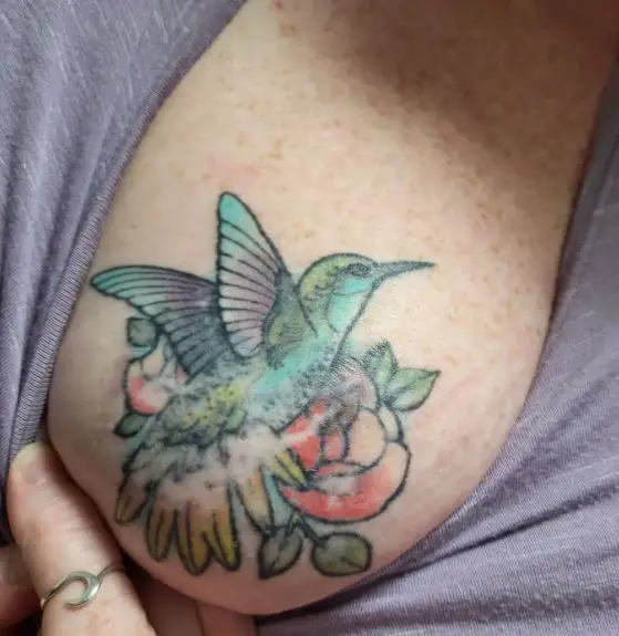 Colorful Hummingbird Breast Tattoo