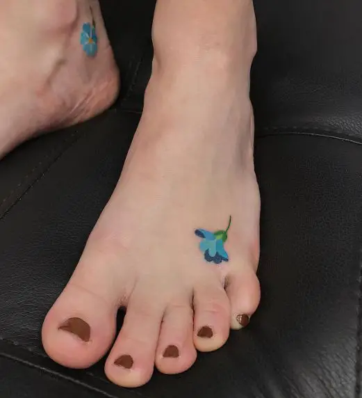 Flashy Blue Forget Me Not Flower Foot Tattoo