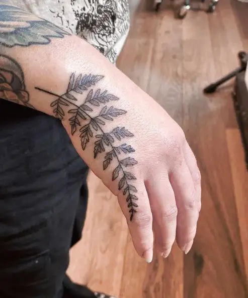 Grey Fern Leaves Hand Tattoo