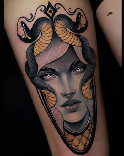 Grey and Yellow Real Looking Medusa Face Tattoo