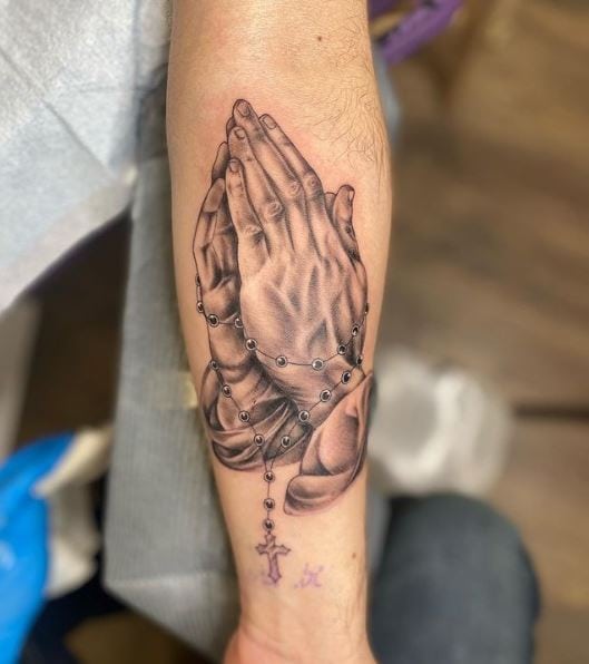 Greyish Praying Hands with Rosary Forearm Tattoo