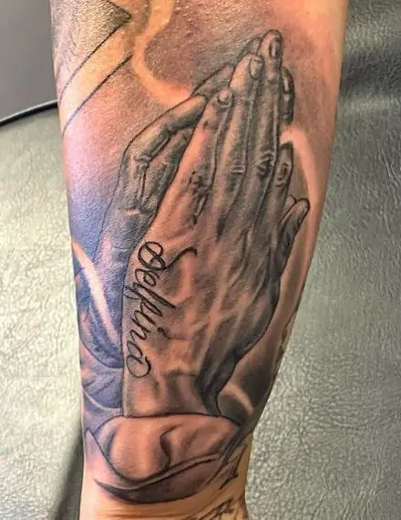 Greyscale Praying Hands with a Name Tattoo