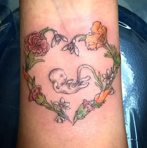 Fetus and Heart Shaped Florals Tattoo