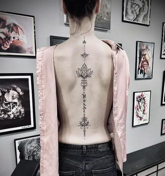Ornamental Flower and Letters Spine Tattoo