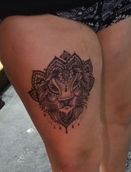Ornamental Lion Face Thigh Tattoo