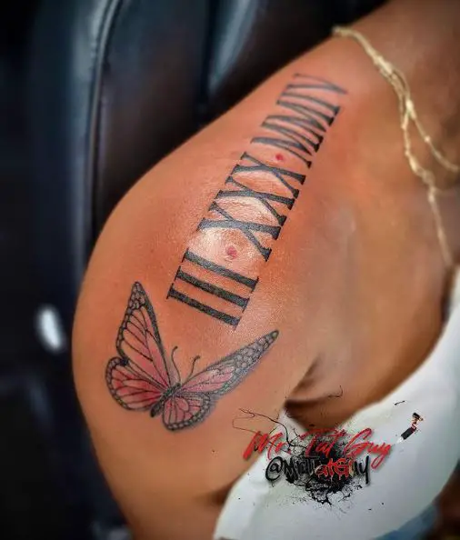 Pink Butterfly and Bold Roman Numerals Shoulder Tattoo
