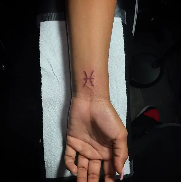 Pink Pisces Symbol Wrist Tattoo