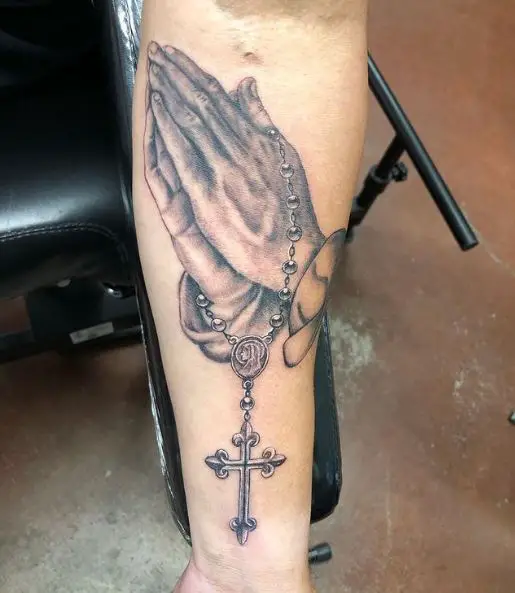 prayer hands tattoo with cross