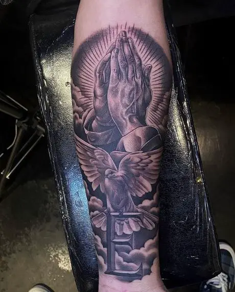 Praying Hands and Dove with Letter E Forearm Tattoo