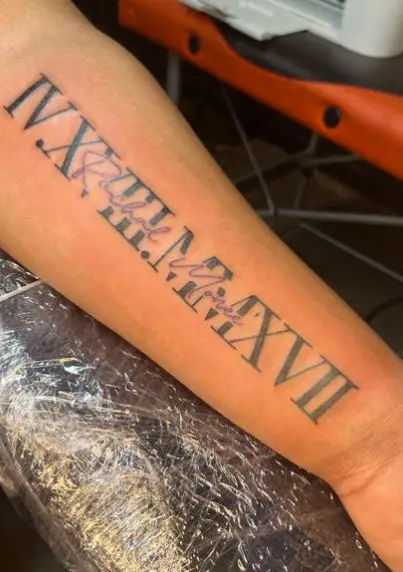 Roman Numeral Birth Year with Lettering Tattoo
