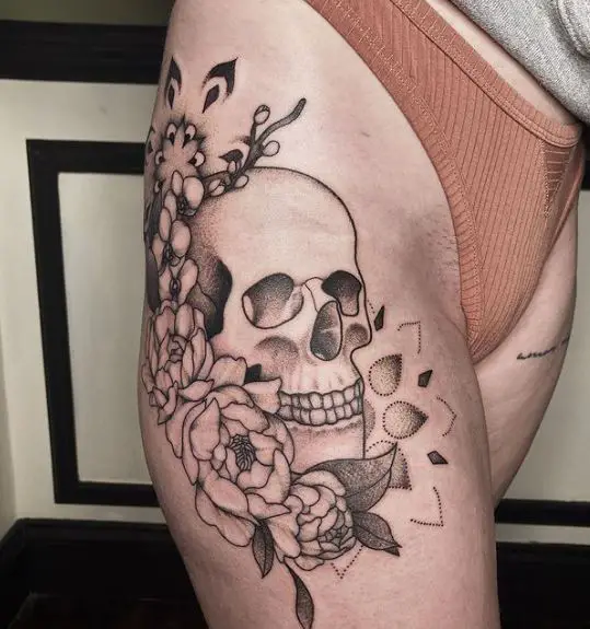 Skull and Flowers Thigh Tattoo