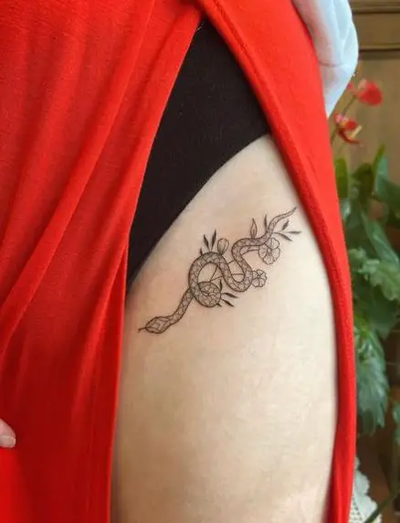 Slithery Snake and Flowers Thigh Tattoo