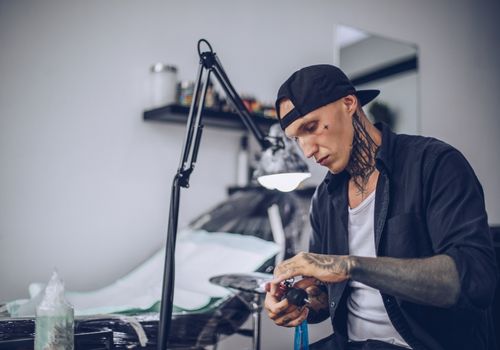 Tattoo Artist Preparing His Tools