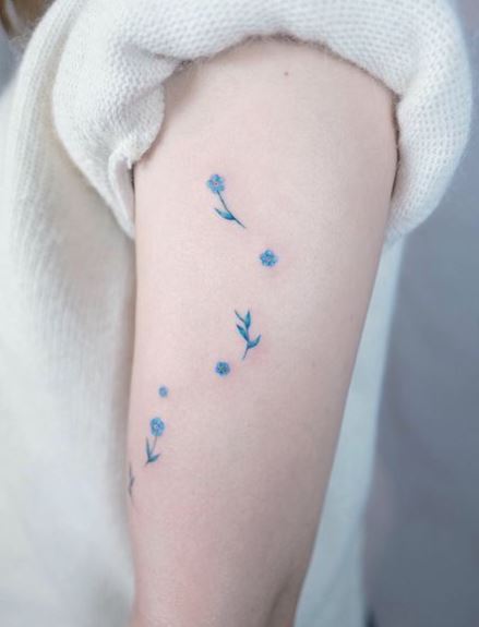 Tiny Blue Flowers Arm Tattoo