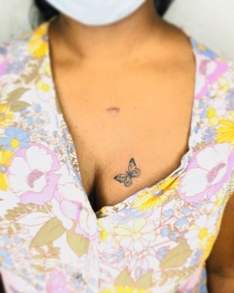 Tiny Grey Breast Tattoo