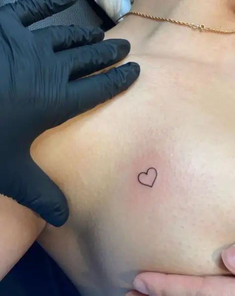 Tiny Heart Breast Tattoo