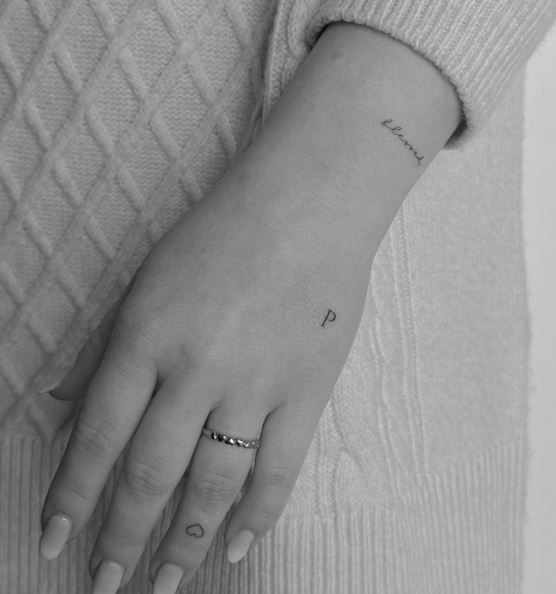 Tiny Letters and Heart Symbol Tattoo