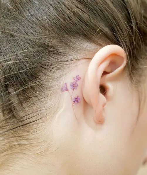 Tiny Purple Forget-Me-Nots Tattoo Behind the Ear