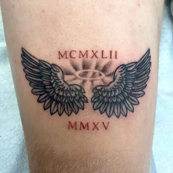 Wings and Roman Numerals Tattoo Piece