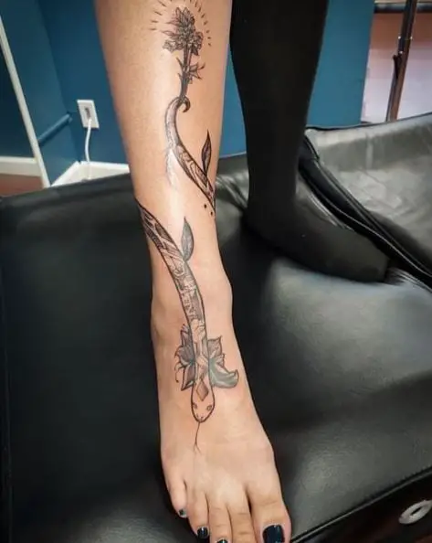 Wrap Around Snake and Floral Leg Tattoo