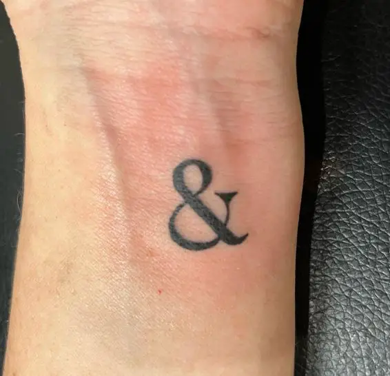 Black Minimalistic Ampersand Wrist Tattoo