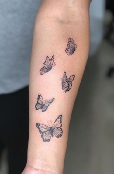 Five Flying Butterflies Forearm Tattoo