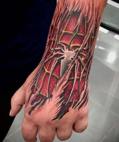 Torn Skin and Spiderman Suit Wrist and Hand Tattoo