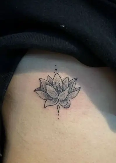 Grey Shaded Lotus Ribs Tattoo