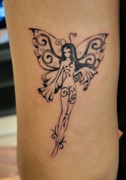 Minimalistic Black Fairy Arm Tattoo