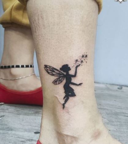 Black Shadow Fairy with Fairy Dust Ankle Tattoo