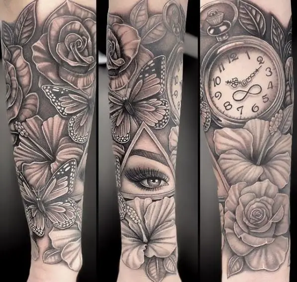Flowers and All Seeing Eye with Butterfly and Clock Forearm Tattoo