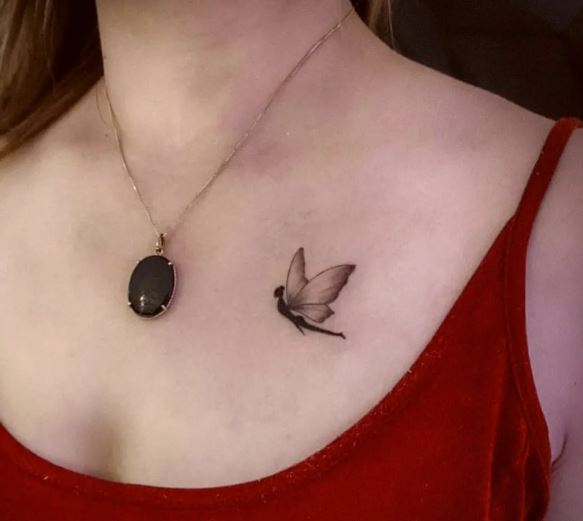 Minimalistic Black Shadow Fairy Chest Tattoo