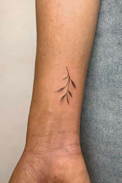 Black Minimalistic Leaf Wrist Tattoo