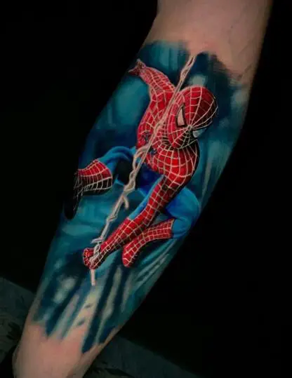 Skyscrapers and Swinging Spiderman Calf Tattoo