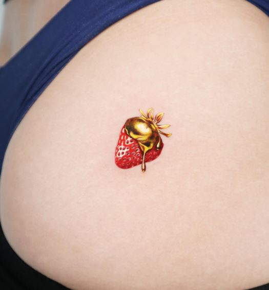 Melting Gold and Red Strawberry Butt Tattoo