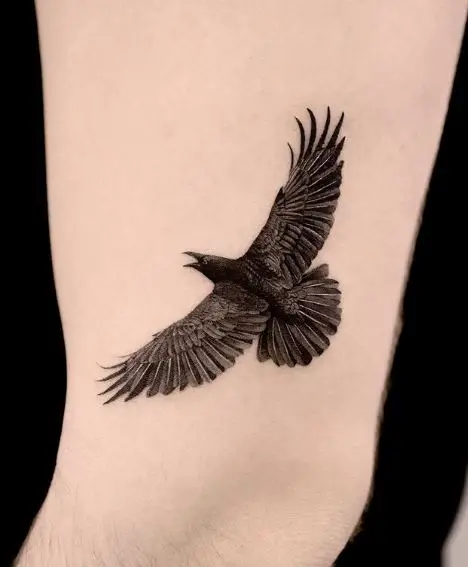 Black Flying Raven Arm Tattoo