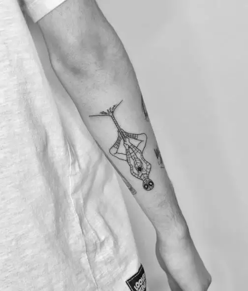 Black and White Hanging Upside Down Spiderman Forearm Tattoo