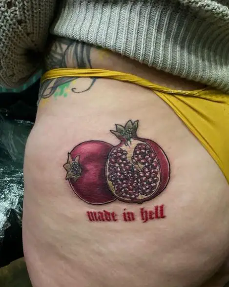 Colorful Pomegranate with Script Butt Tattoo