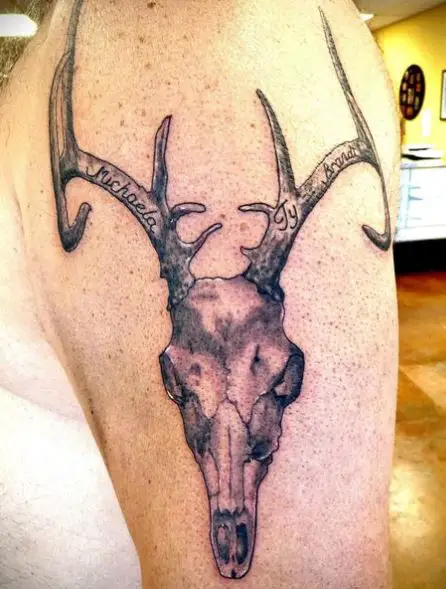 Black and Grey Deer Skull with Lettering Arm Tattoo