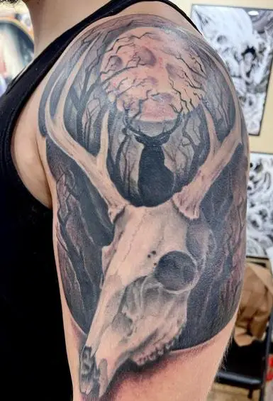 Silhouette of Deer and Deer Skull Arm Tattoo