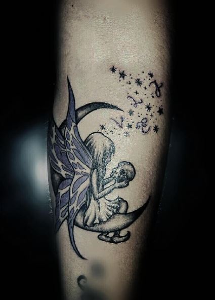 Half Moon and Fairy with Skull Forearm Tattoo