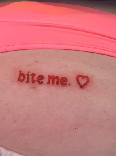 Minimalistic Red Bite Me with Heart Butt Tattoo