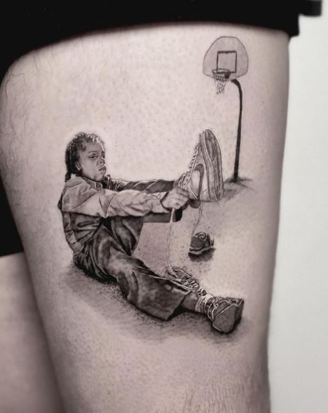 Black and Grey Child and Basketball Court Thigh Tattoo