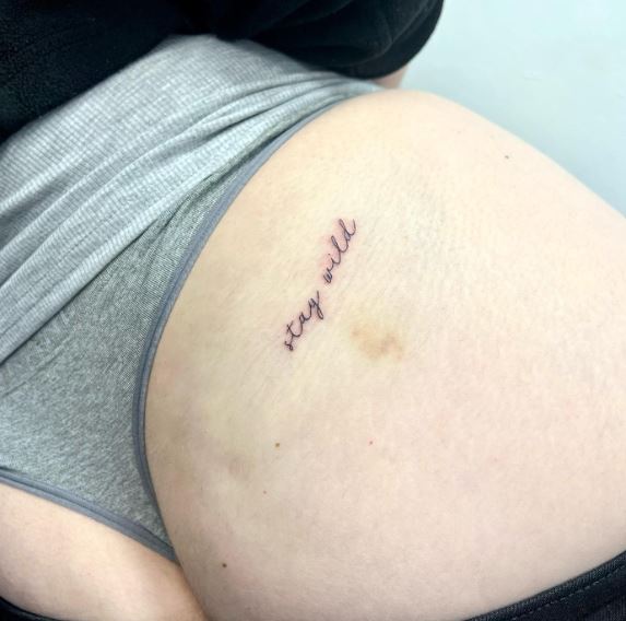 Script Stay Wild Butt Tattoo
