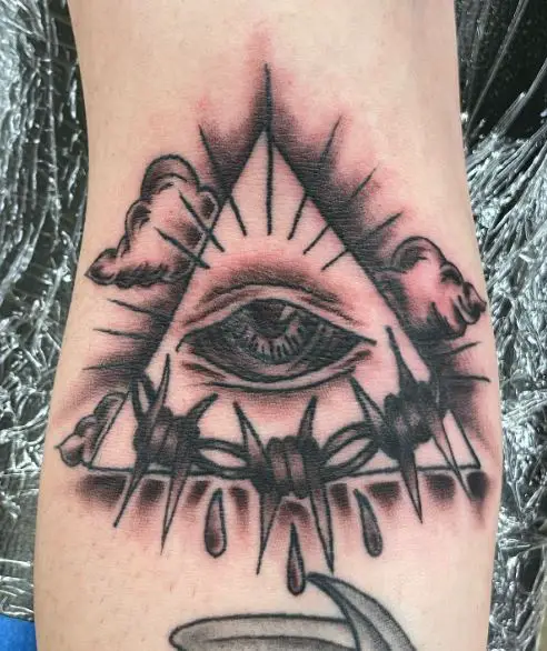 All Seeing Eye with Barb Wire Arm Tattoo